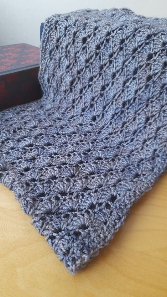 Close up of the wave crochet cowl. The pattern uses double crochet to create shell stitch. 