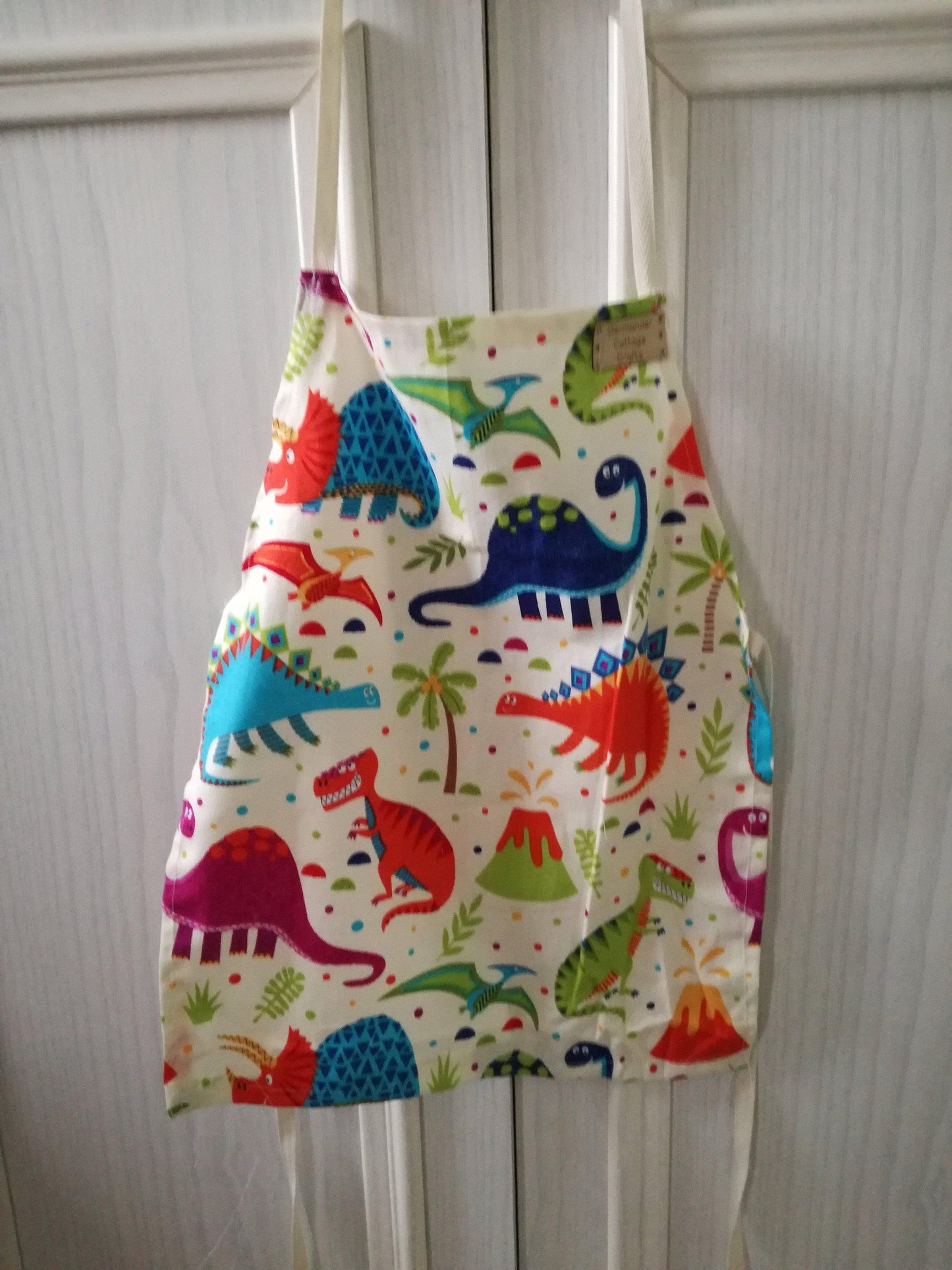 Handmade accessories for kids. Dino aprons for children. Adult novelty aprons
