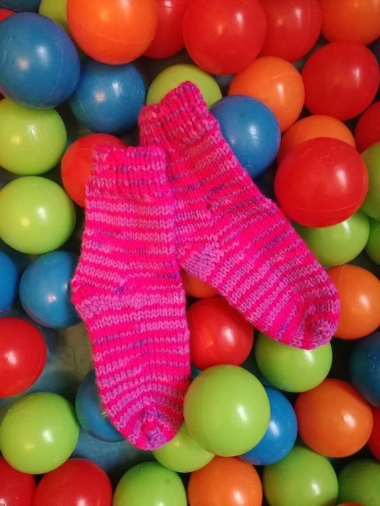 Ball Pool Children's sock pattern. Pink knitted childrens socks. 