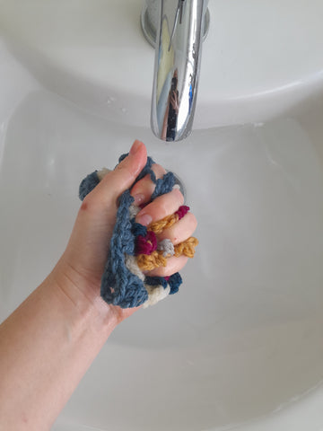 Wet blocking. Squeeze the excess water out of your square