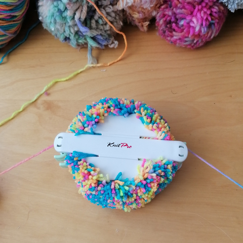 Knitters pride pom pom maker for easy pom poms.